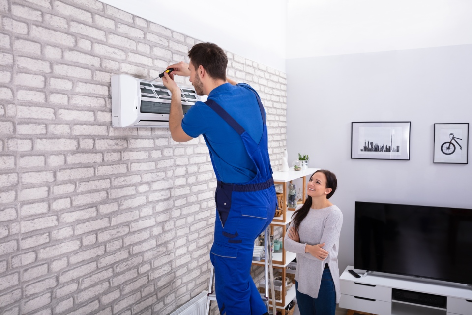 Technician installing AC